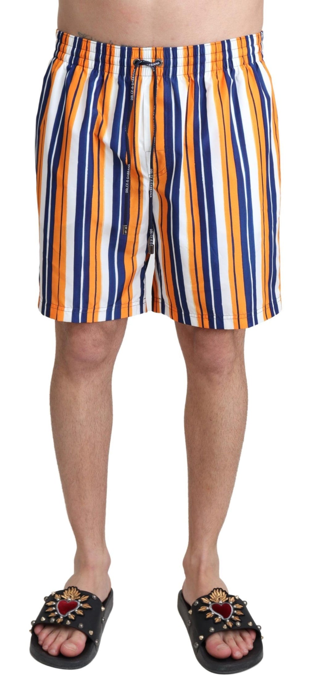 Shorts de bain multicolores à rayures Dolce & Gabbana, maillot de plage pour homme avec motifs vibrants et style élégant.