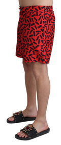Shorts de bain Dolce & Gabbana à motif rouge, vêtement de plage pour homme, vue de face.