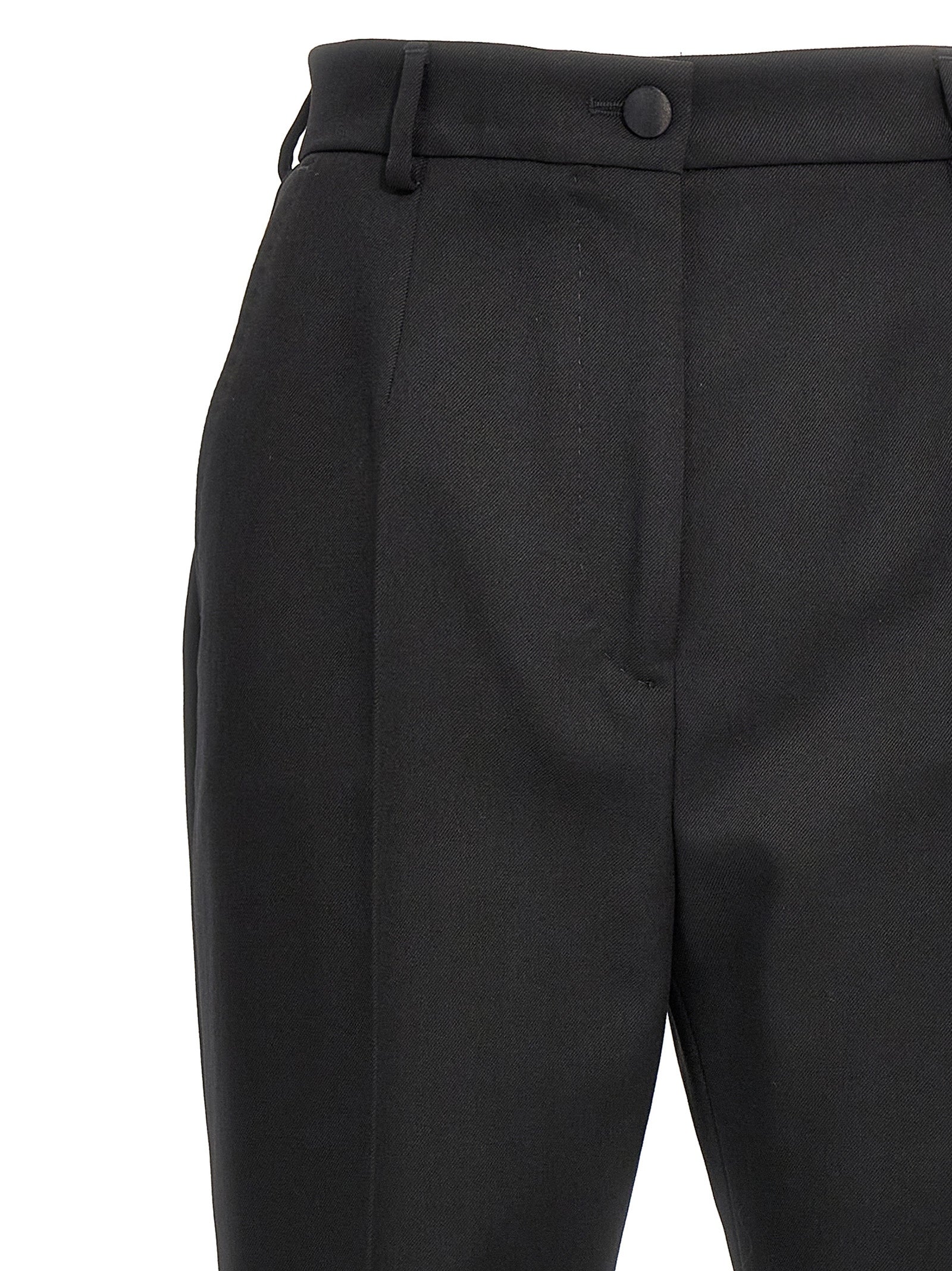 Pantalon noir en laine virgin Dolce & Gabbana pour femme, coupe élégante et matière douce visible sur l'image.