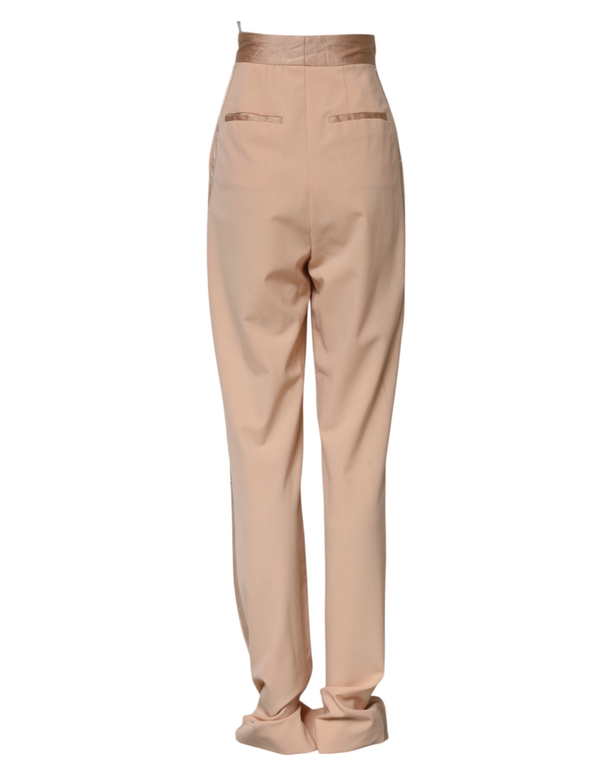 Pantalon beige en polyester à taille moyenne et coupe tapered par Dolce & Gabbana, visible avec détails de couture.
