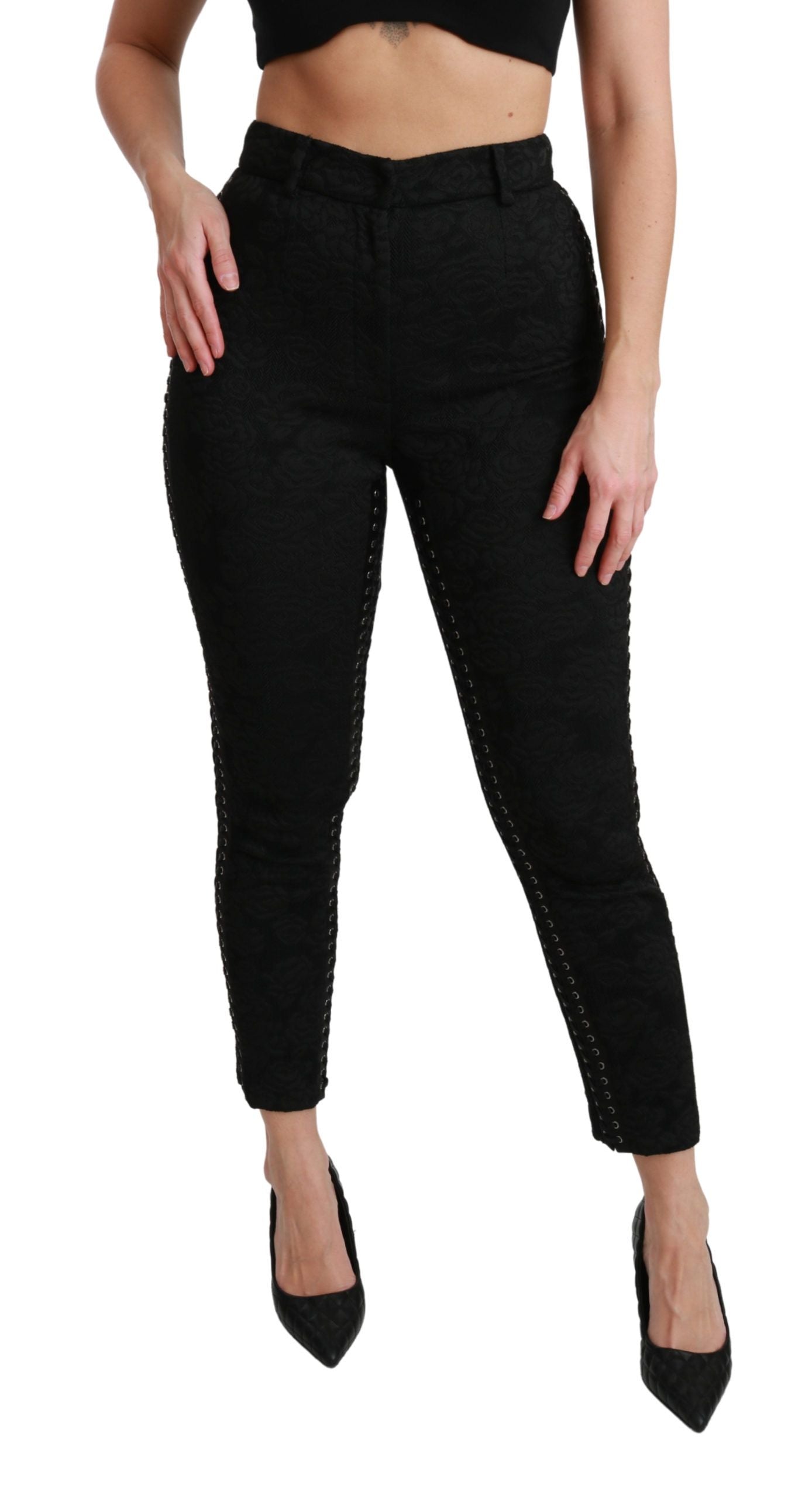 Pantalons noirs en brocart Dolce & Gabbana, taille haute et skinny, détails élégants et motif sophistiqué.