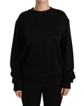 Pull en coton noir Dolce & Gabbana à col rond, vue de face, avec détails de couture visibles.