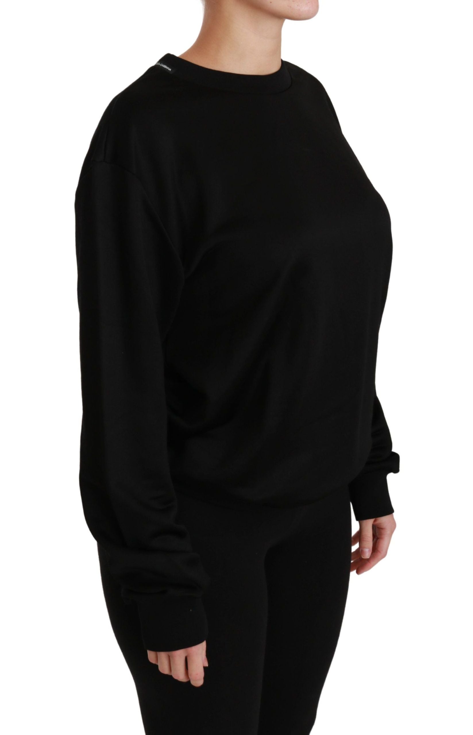 Pull-over noir en coton Dolce & Gabbana, col rond, style casual et élégant, visible sur l'image.
