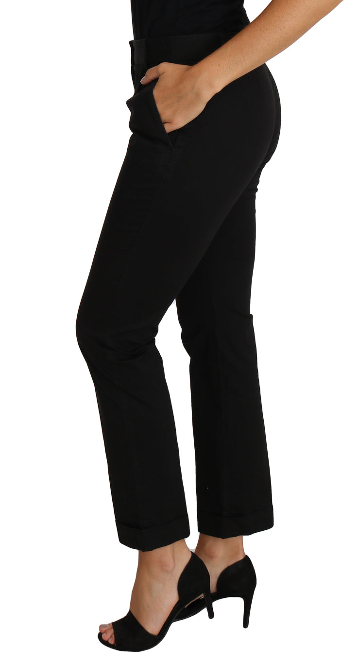 Robe noire Dolce & Gabbana avec pantalon droit court, style élégant et moderne, vue de l'avant montrant la coupe ajustée.