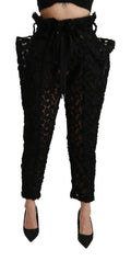 Pantalons taille haute en dentelle florale noire de Dolce & Gabbana, coupe tapered élégante.