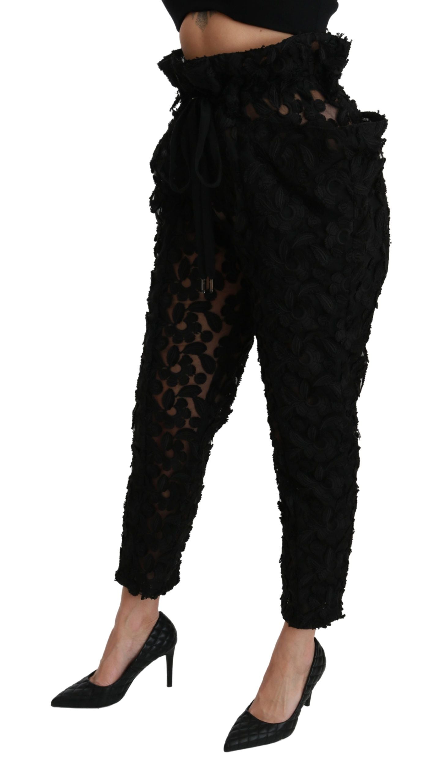 Pantalons noir en dentelle florale Dolce & Gabbana à taille haute et coupe tapered, mode élégante et raffinée.