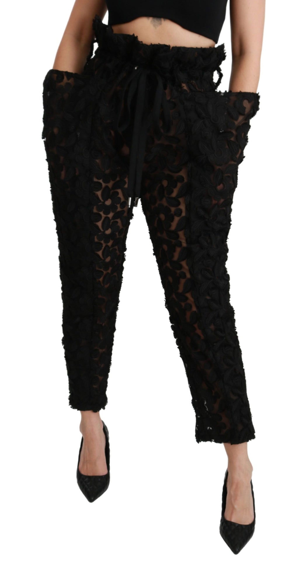 Pantalons noirs Dolce & Gabbana en dentelle florale, taille haute et coupe tapered, élégants et sophistiqués.