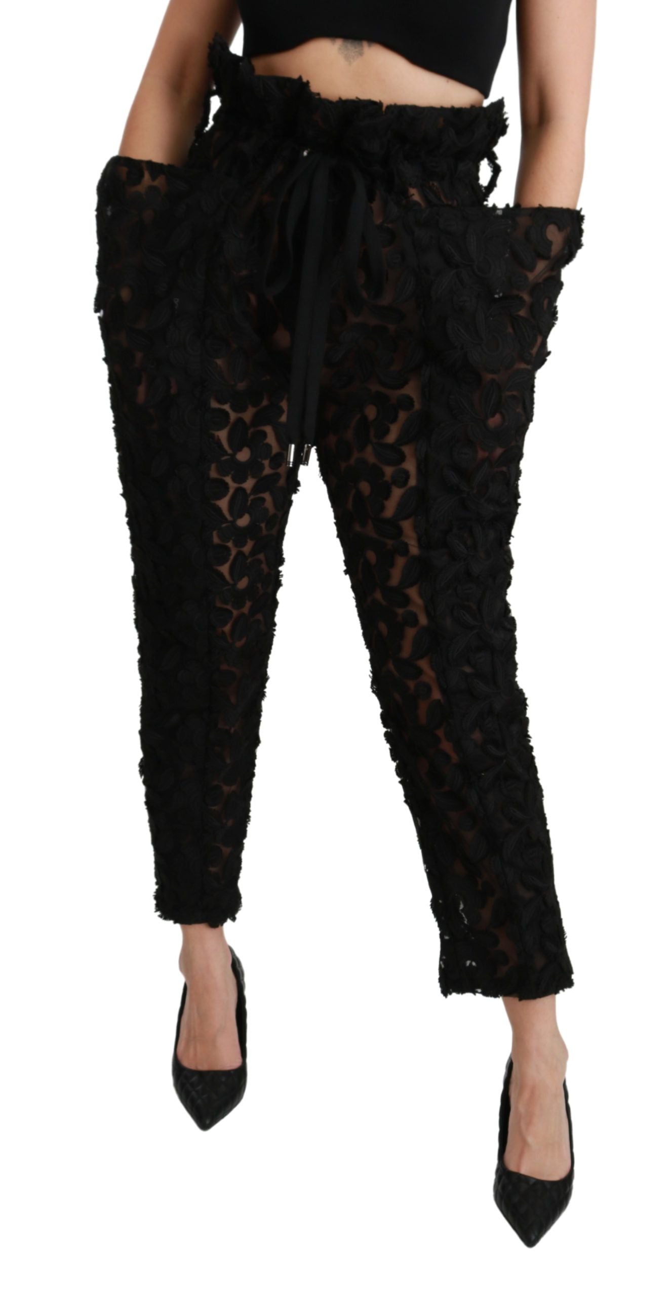 Pantalons noirs Dolce & Gabbana en dentelle florale, taille haute et coupe tapered, élégants et sophistiqués.