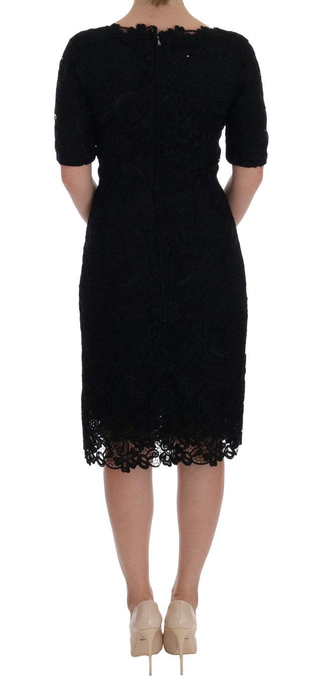 Robe droite noire Dolce & Gabbana à broderie florale, élégante et sophistiquée, visible en détail dans l'image.