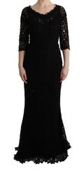 Robe longue Dolce & Gabbana noire à fleurs en ricamo, style cachetée, avec coupe élégante et détails floraux sophistiqués.