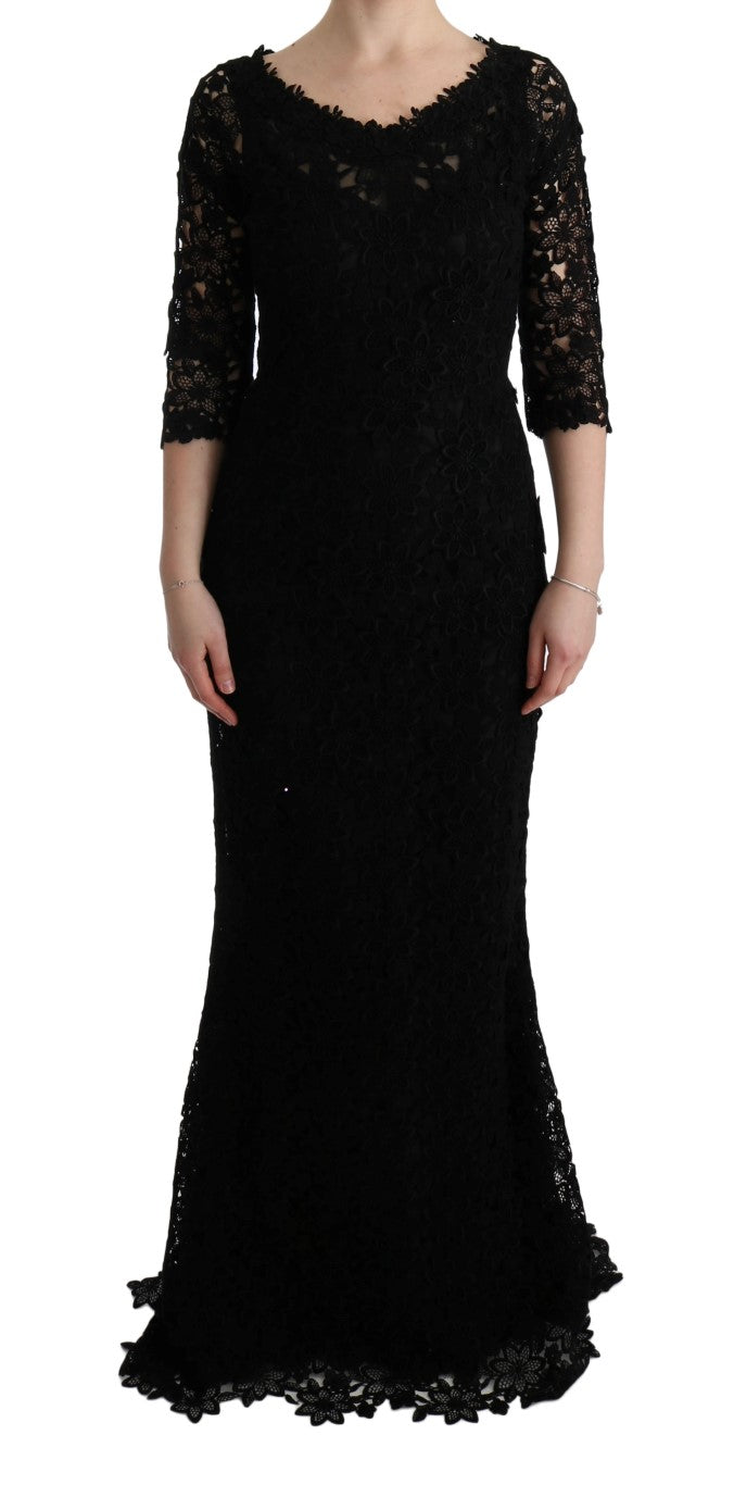 Robe longue Dolce & Gabbana noire à fleurs en ricamo, style cachetée, avec coupe élégante et détails floraux sophistiqués.