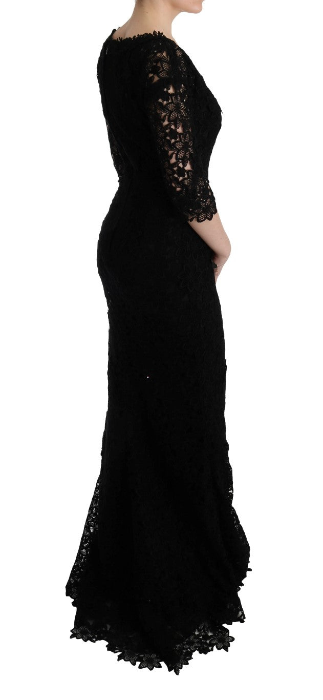 Robe longue Dolce & Gabbana noire à fleurs en ricamo, coupe droite et élégante, détails floraux visibles sur le tissu.