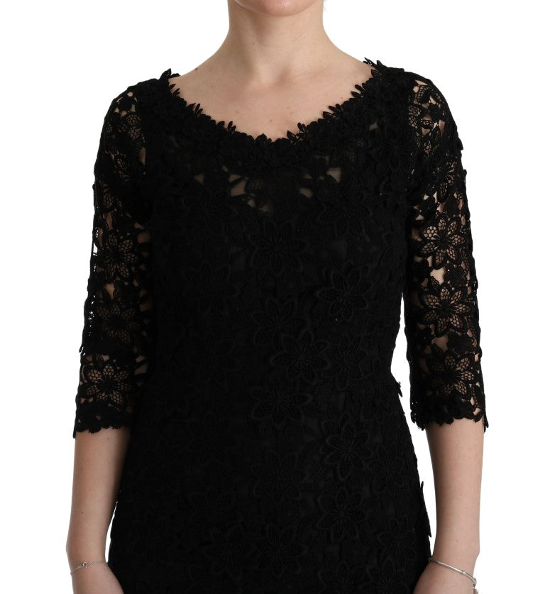 Robe longue noire Dolce & Gabbana en tissu floral ricamo, coupe ajustée et élégante pour occasions spéciales.