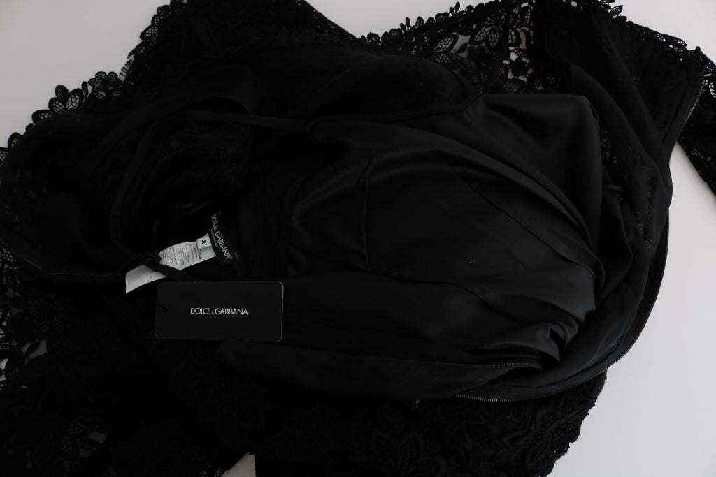 Robe longue noire à fleurs en ricamo de Dolce & Gabbana, coupe ajustée et élégante avec détails floraux sophistiqués.