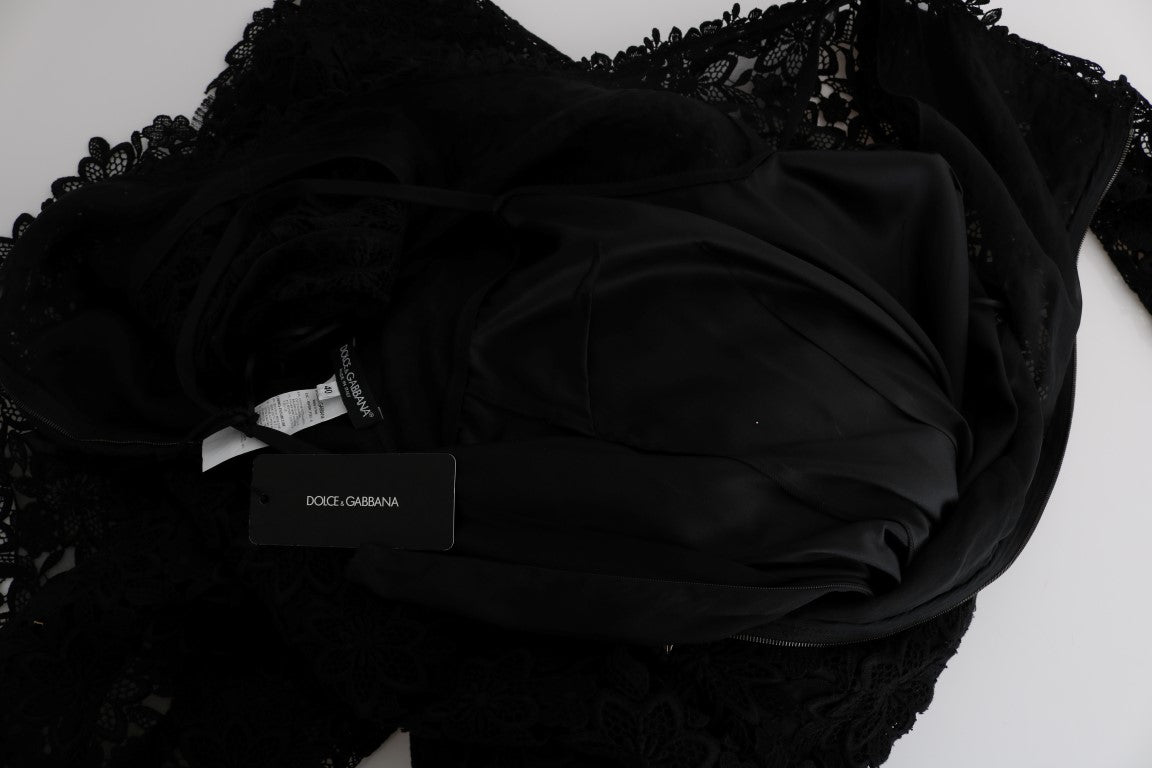 Robe longue noire à fleurs en ricamo de Dolce & Gabbana, coupe ajustée et élégante avec détails floraux sophistiqués.