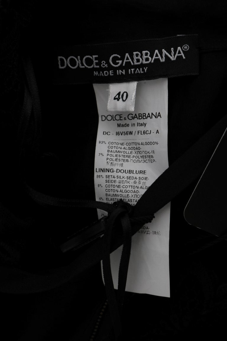 Robe longue noire Dolce & Gabbana à broderie florale élégante, coupe cintrée et détails sophistiqués.