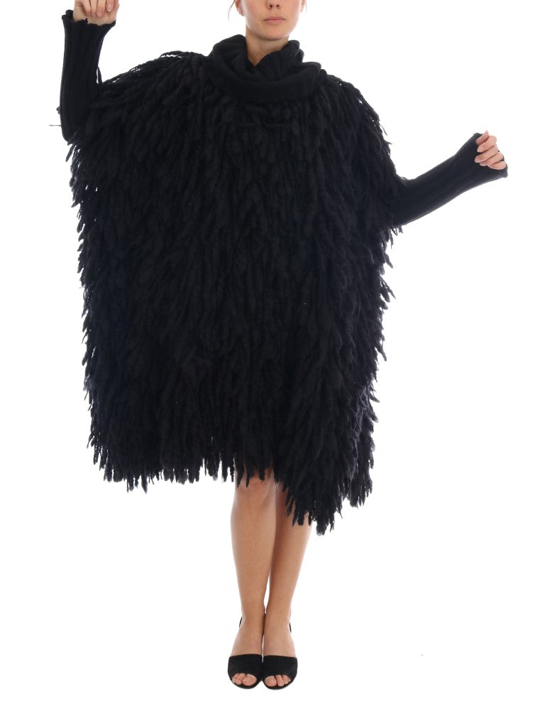 Pull en laine noir Dolce & Gabbana avec franges, coupe décontractée et détails élégants, idéal pour un style sophistiqué.