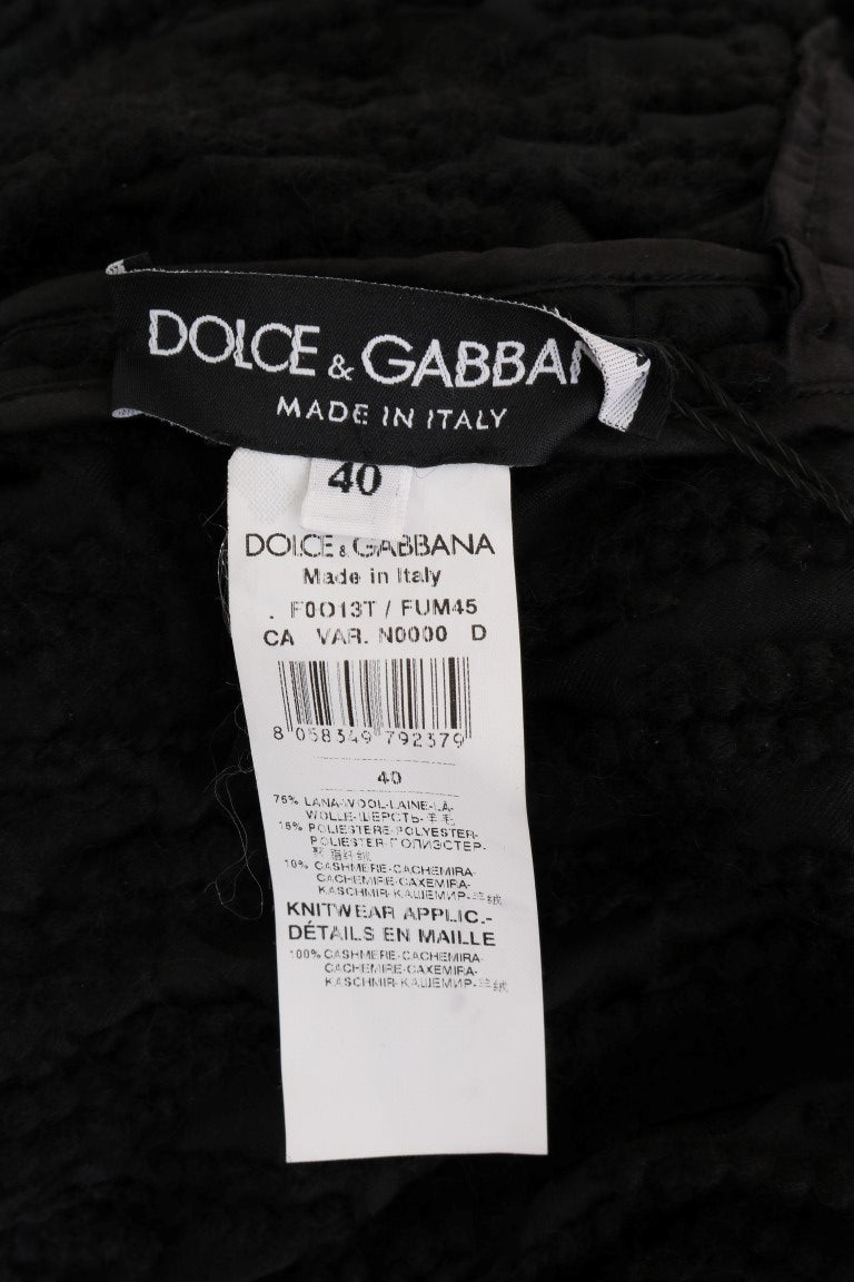 Pull en laine noir Dolce & Gabbana avec franges, vue de face, montrant le design élégant et les détails du pull.
