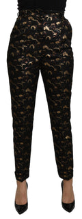 Pantalon noir et or à taille haute Dolce & Gabbana en brocart élégant, avec détails sophistiqués et coupe flatteuse.