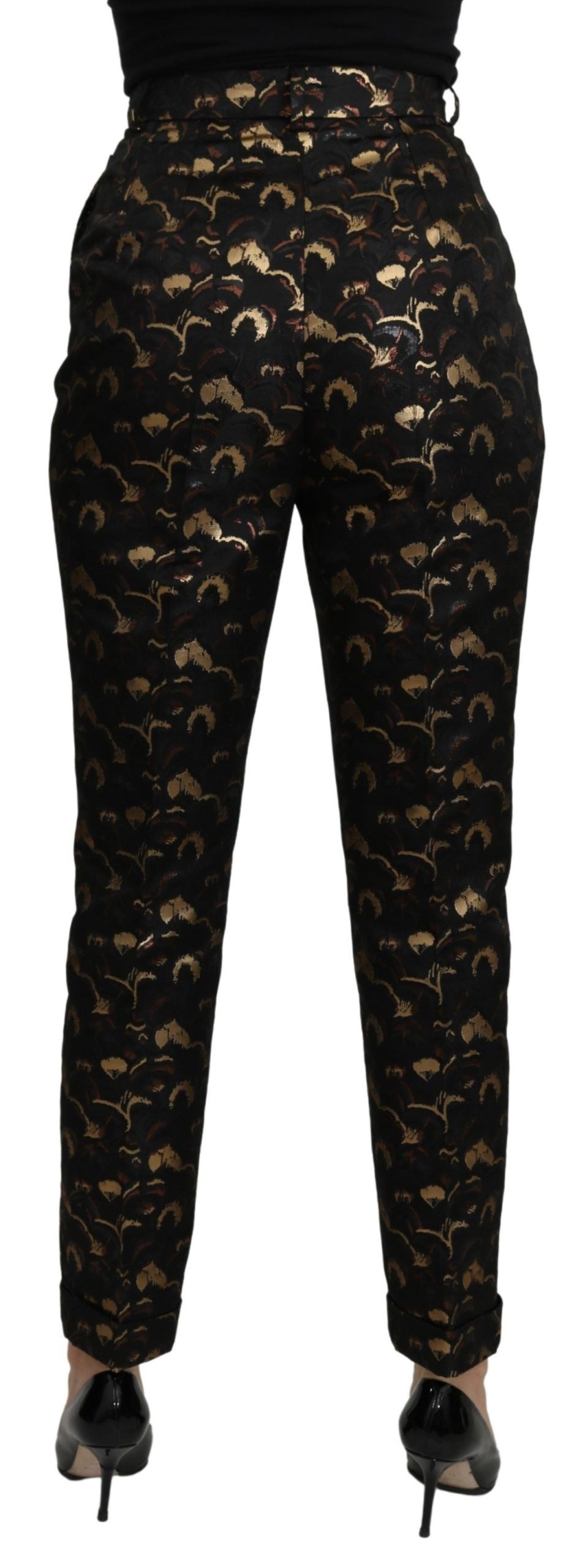 Pantalon taille haute Dolce & Gabbana en brocart noir et or, avec finition élégante et détails sophistiqués.