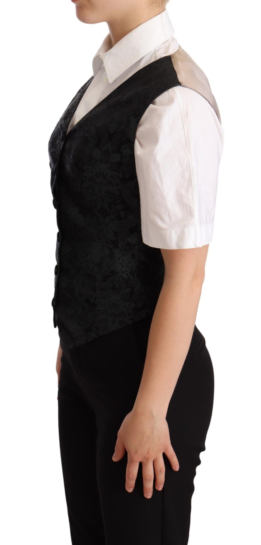 Gilet en jacquard floral noir de Dolce & Gabbana avec taille cintrée et détails verts, vue de face.