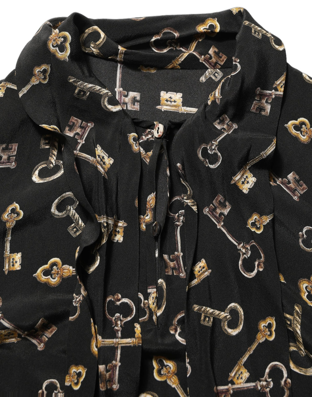 Blouse en soie noire Dolce & Gabbana avec motif de clés, col en ras du cou, détails élégants et style sophistiqué.
