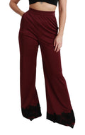 Pantalons Dolce & Gabbana en dentelle noire à taille haute et jambes larges couleur bordeaux.