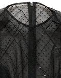 Robe longue noire en dentelle et mesh de Dolce & Gabbana, vêtement élégant à manches longues et style maxi.