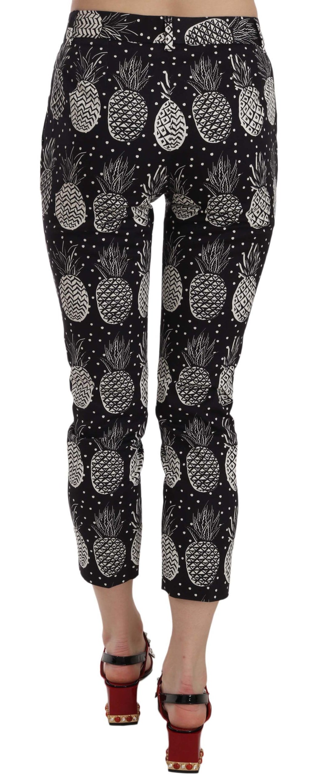 Pantalons capri skinny Dolce & Gabbana à imprimé ananas noir, coupe ajustée, style élégant et tendance.