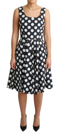 Robe en coton noire à pois Dolce & Gabbana, coupe évasée et élégante, avec motif à pois sur toute la surface.