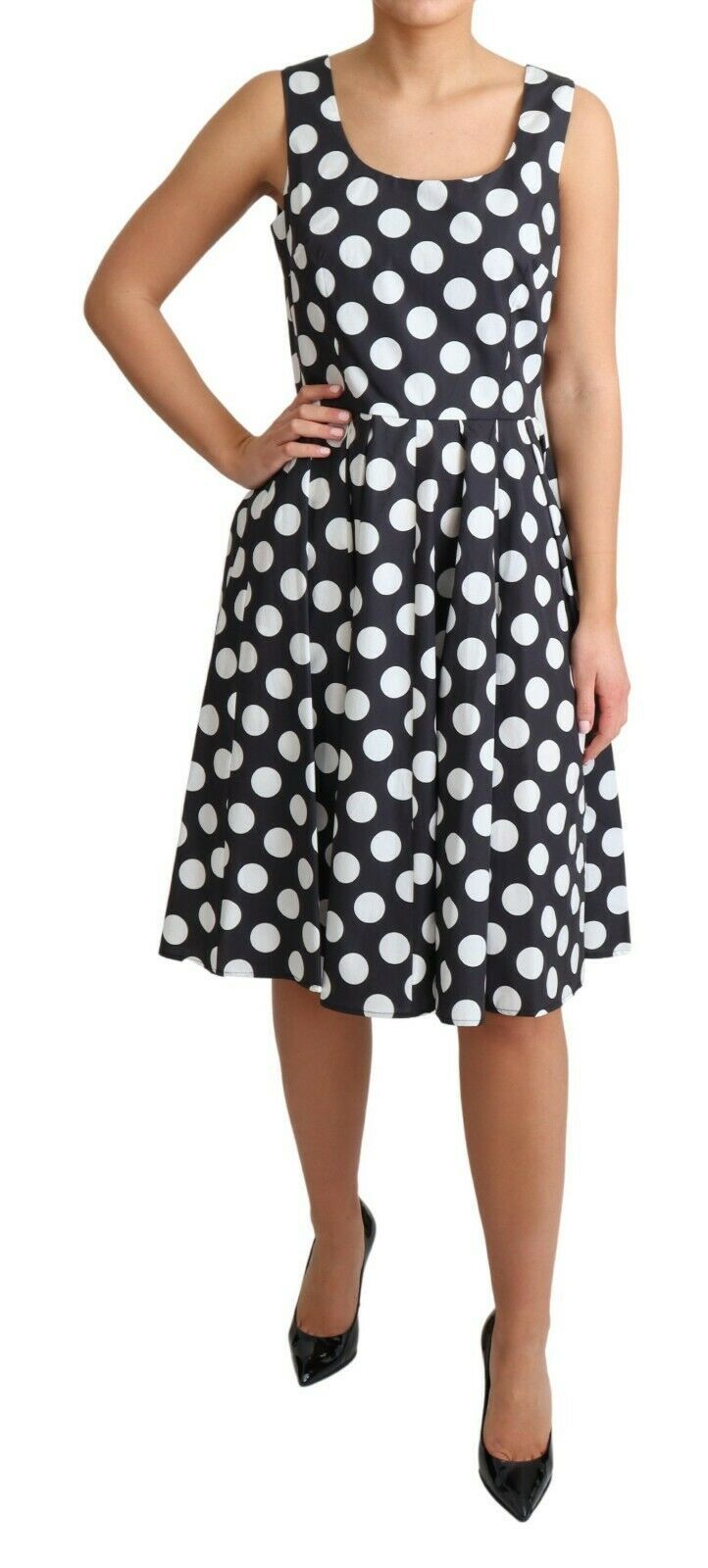 Robe noire à pois en coton Dolce & Gabbana, coupe évasée et élégante, avec motifs à pois blancs sur fond noir.