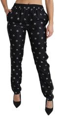 Pantalons slim en soie noire imprimée de Dolce & Gabbana, taille mi-haute, look élégant et moderne