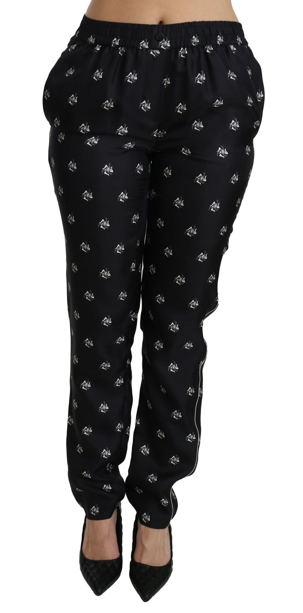 Pantalon skinny en soie noir à imprimé de Dolce & Gabbana, taille mi-haute, ajusté et élégant, visible en gros plan.