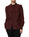 Haut longue en soie noir et rouge à pois de Dolce & Gabbana avec manches longues, style élégant et sophistiqué.