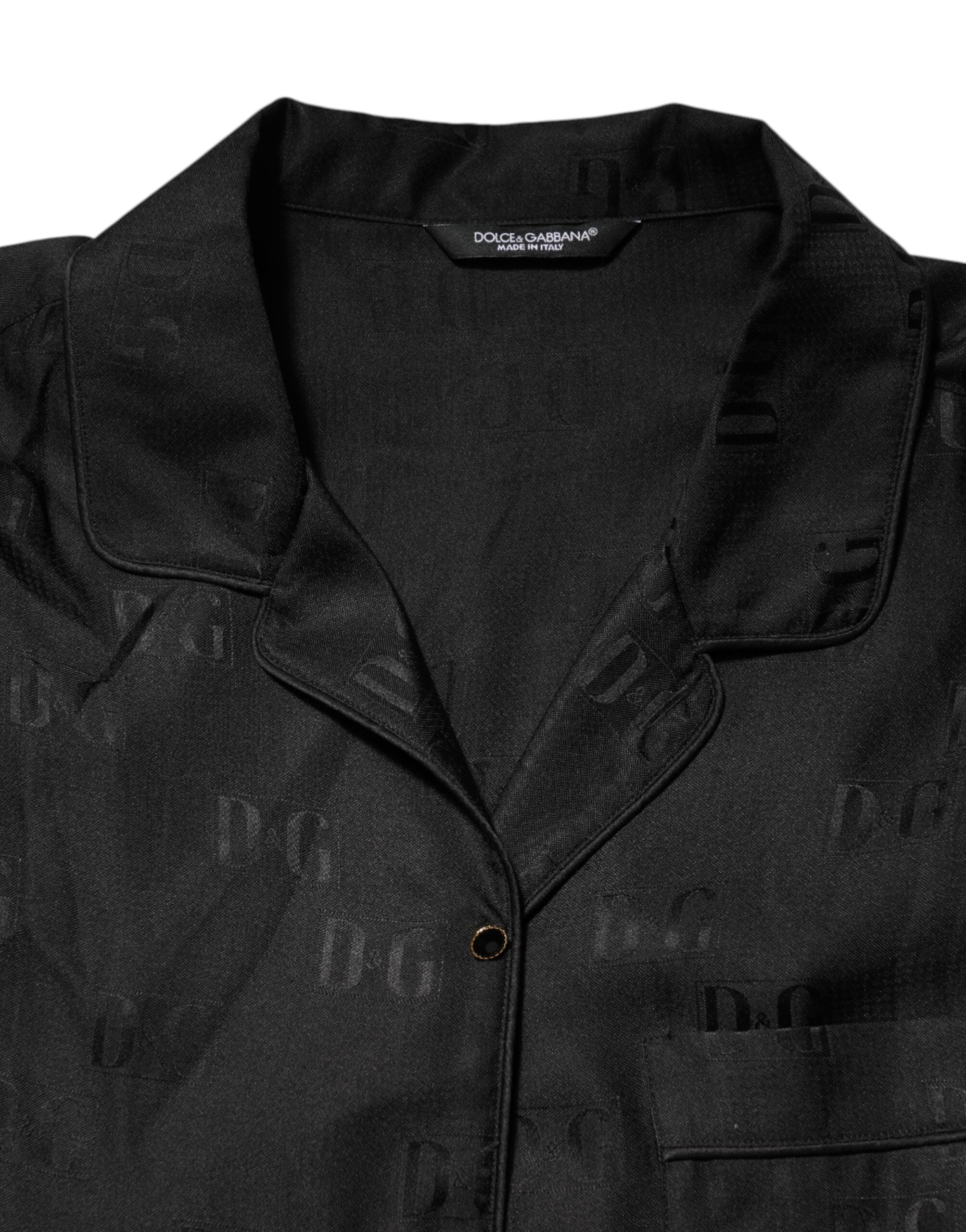 Haut en soie noire Dolce & Gabbana avec broderie DG à manches longues, élégant et sophistiqué, vue de face.