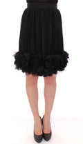 Jupe en soie noire transparente au-dessus du genou de Dolce & Gabbana, élégante et sophistiquée, visible en détail.