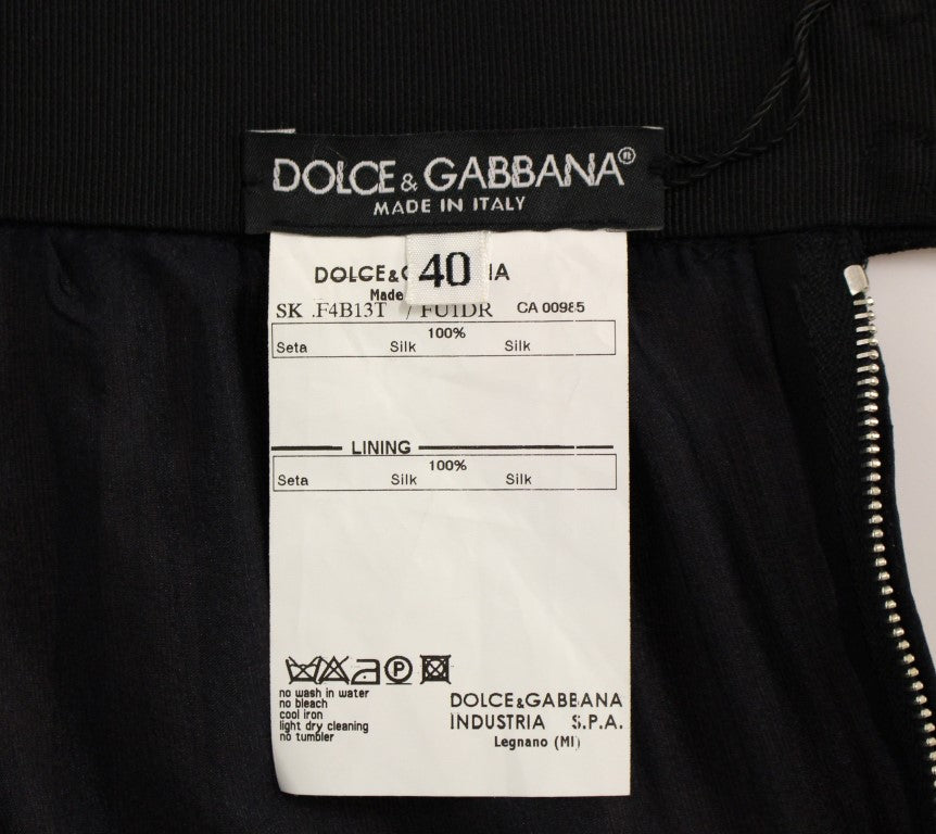Jupe en soie noire transparente au-dessus du genou de Dolce & Gabbana, élégante et sophistiquée.