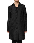 Manteau trench noir à un seul rangée de boutons de la marque Dolce & Gabbana, veste élégante et classique pour femme.
