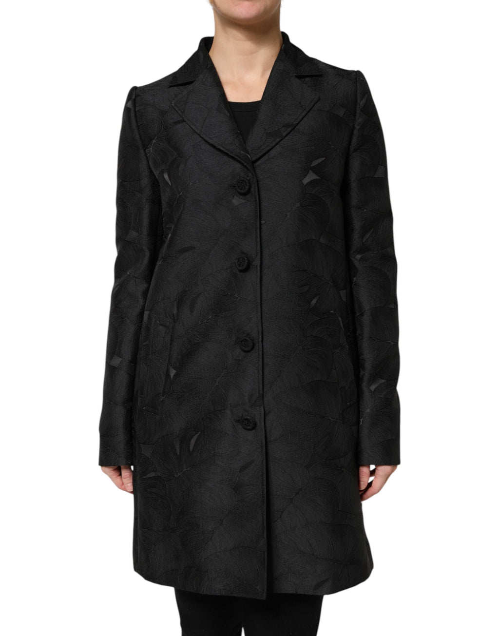 Manteau trench noir à un seul boutonnage de Dolce & Gabbana, coupe élégante et classique, vue de face sur fond blanc.