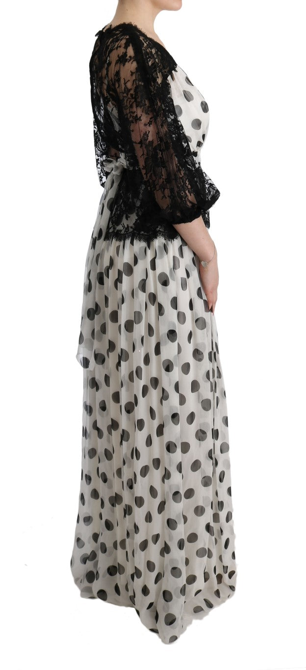 Robe noire et blanche à pois avec motif floral de Dolce & Gabbana, longueur midi, style élégant et féminin.