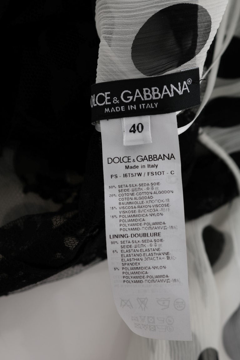 Robe noire et blanche à pois et fleurs de Dolce & Gabbana, robe élégante avec motif floral et design sophistiqué.