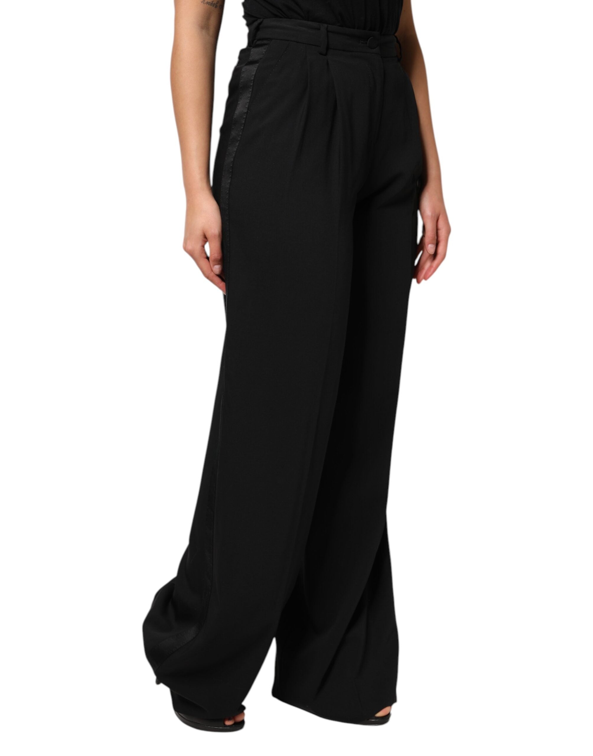 Pantalons en laine noire Dolce & Gabbana à taille haute et jambes larges, vue de face.
