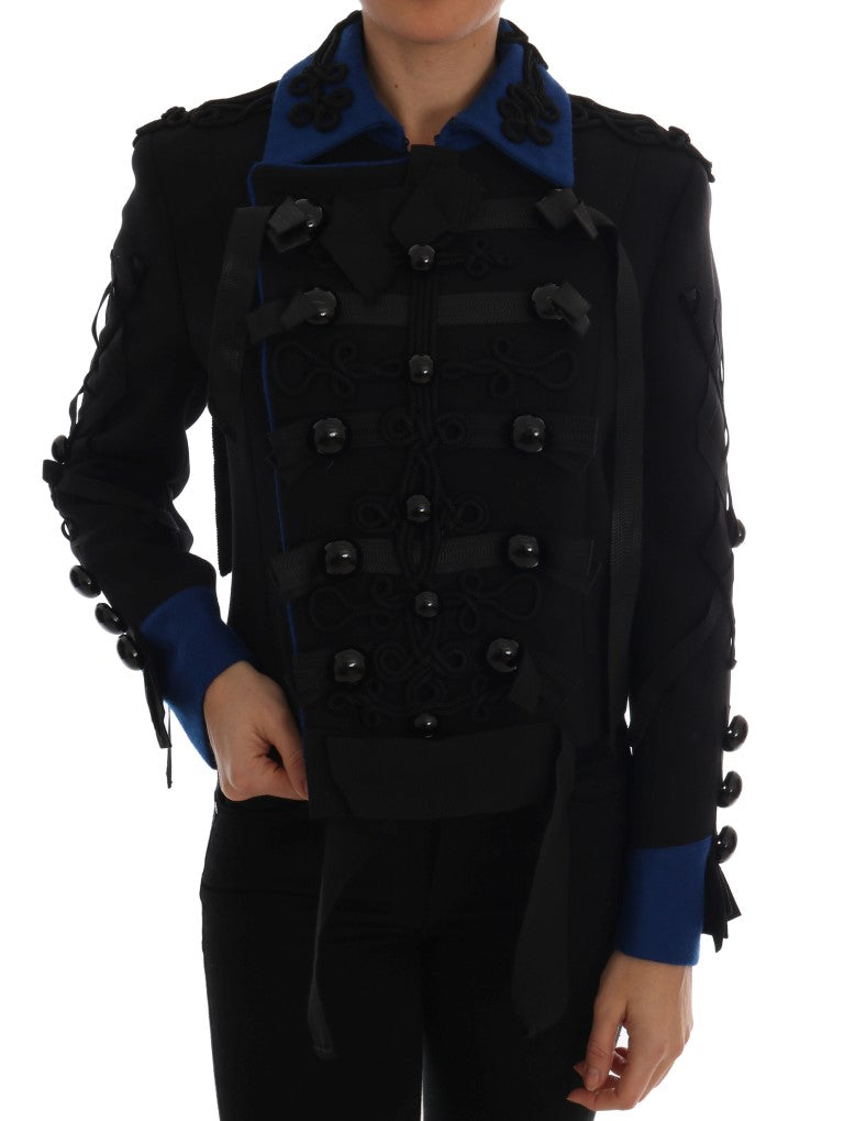 Veste trench en laine noire Dolce & Gabbana, élégante et sophistiquée, avec ceinture et détails classiques.