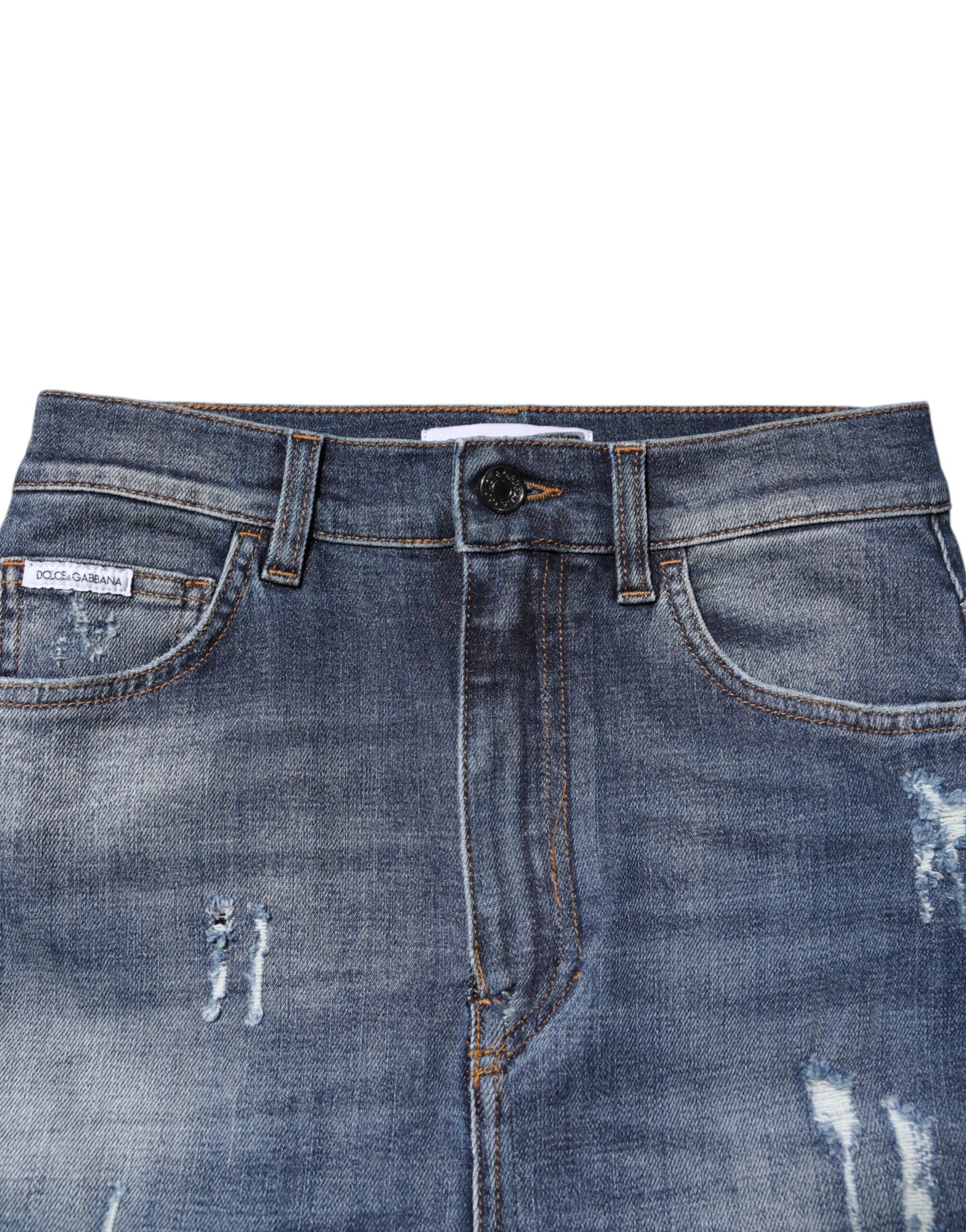 Jeans skinny en denim coton bleu à taille haute de Dolce & Gabbana, vue en gros plan devant un fond neutre.