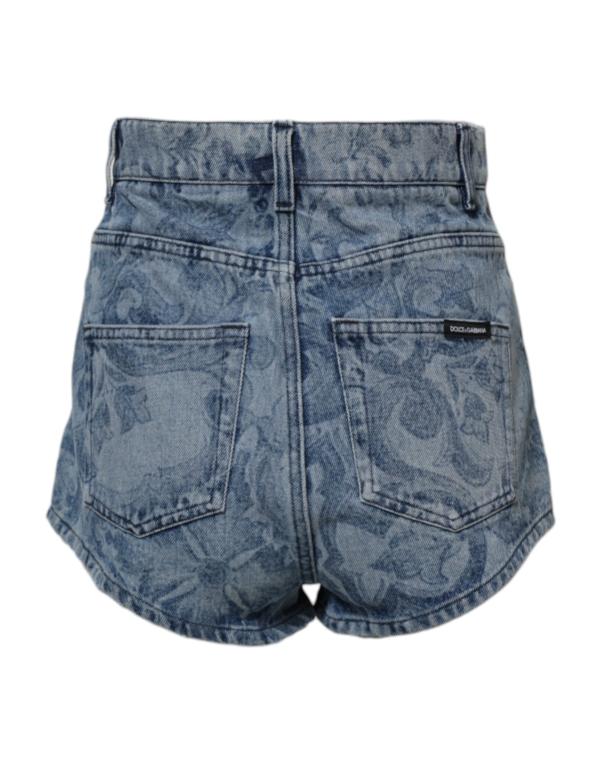 Shorts en denim coton Dolce & Gabbana à imprimé floral bleu, style hot pants, visibles avec détails colorés et coupe ajustée.