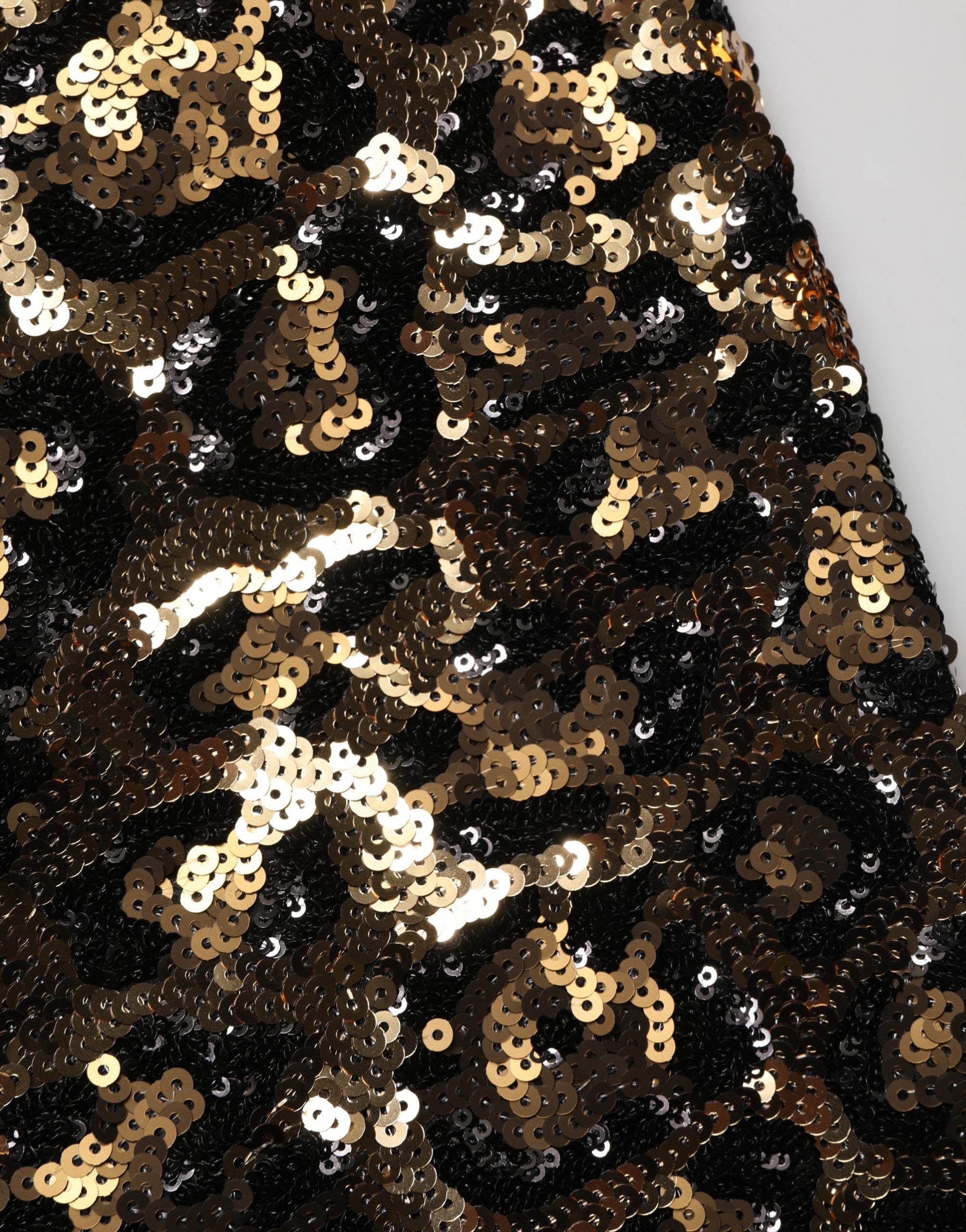 Pantalon droit en sequins dorés à motif léopard de Dolce & Gabbana, style élégant et tendance.