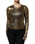 Pull à manches longues Dolce & Gabbana orné d'un col rond en or, élégant et sophistiqué, porté sur un mannequin.