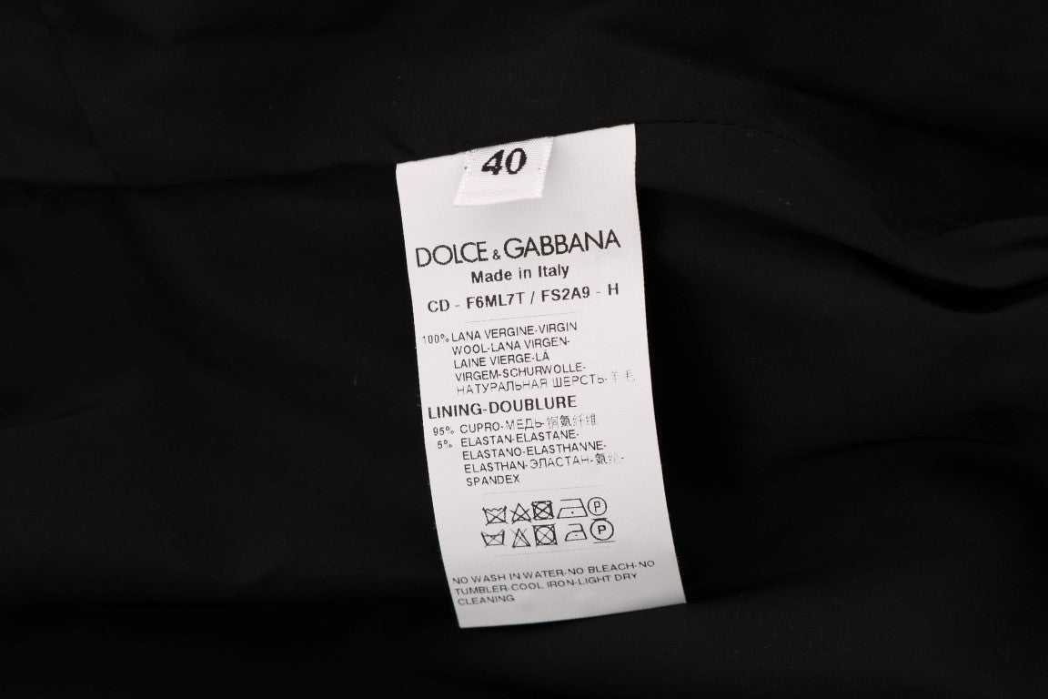 Robe fourreau en laine gris à pois blancs de Dolce & Gabbana, élégante et sophistiquée, visible sur cette image.