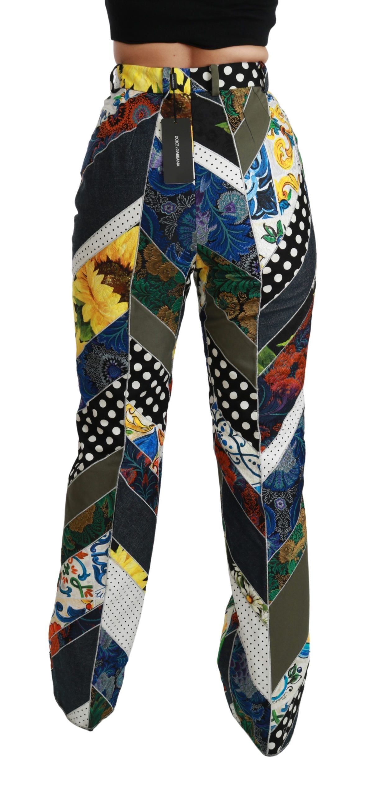 Pantalons Dolce & Gabbana à taille haute avec motif multicolore et coupe droite, visibles dans l'image.