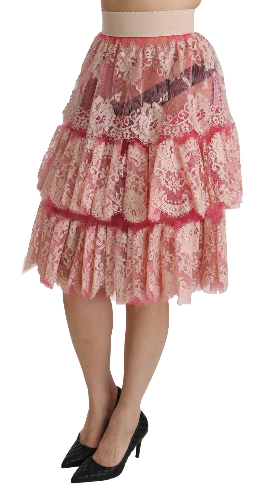 Jupe longue à la taille haute en dentelle rose de Dolce & Gabbana, style superposé et élégant, longueur jusqu'aux genoux.